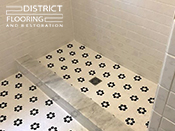 Flower mosaic tiles installed by District Flooring & Restoration 